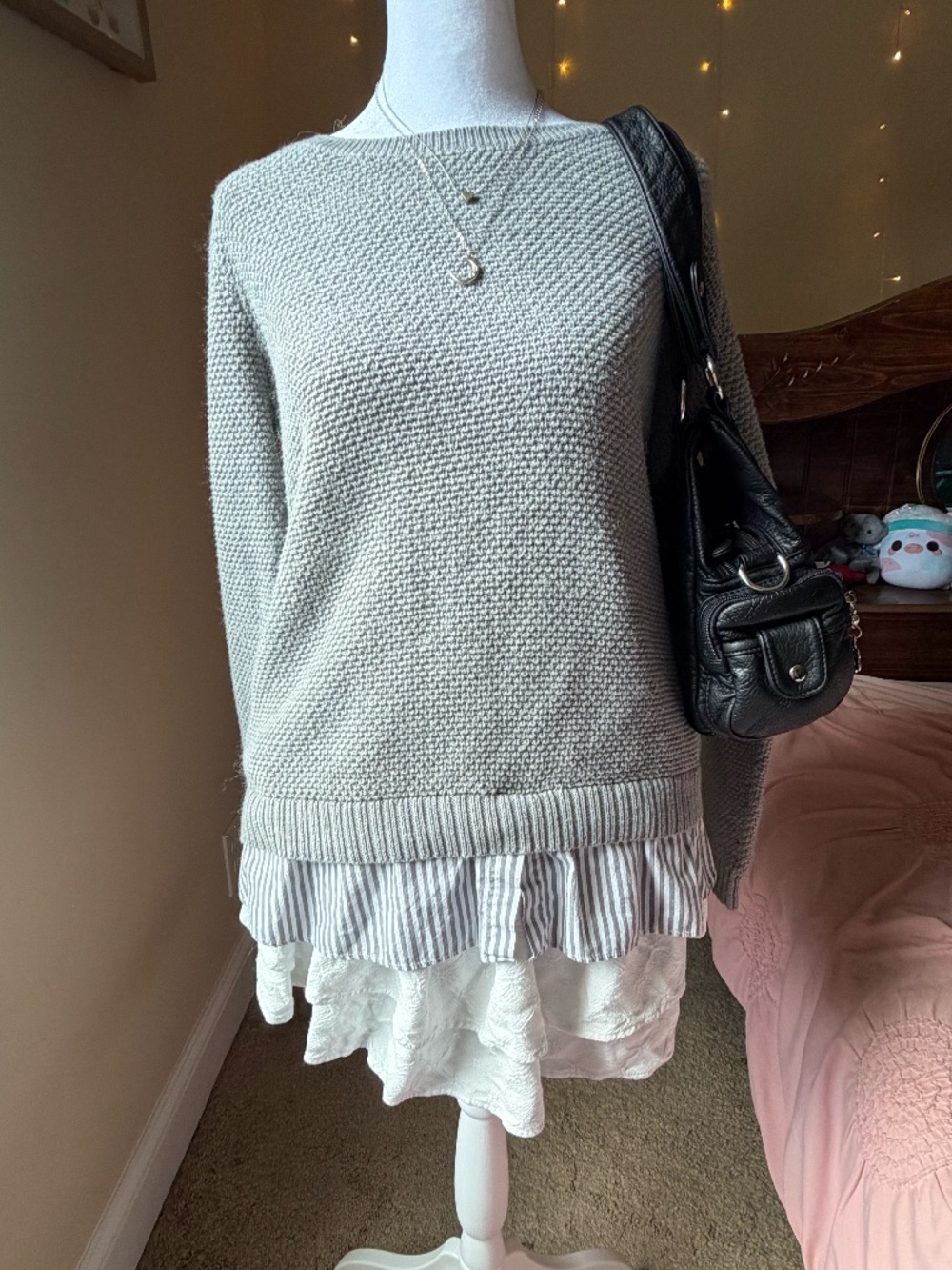Long sleeve knit sweater with a built-in striped peplum shirt